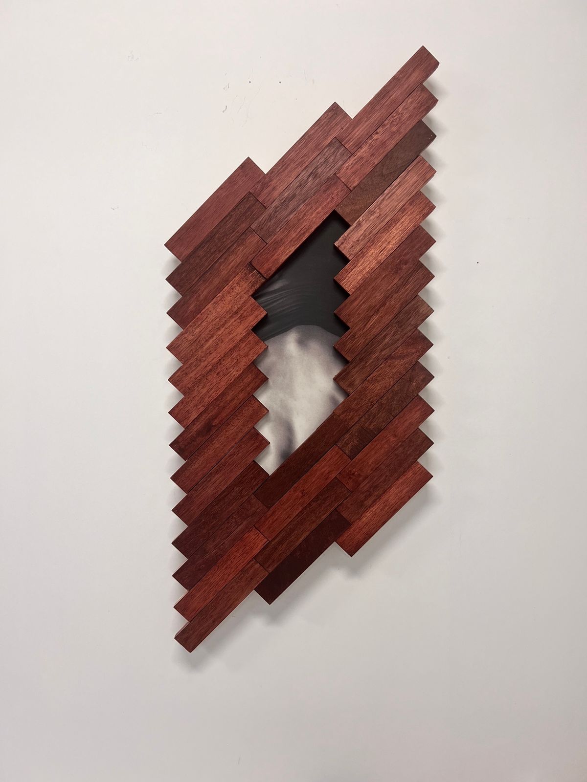 Intersections Dylan Chan Uncanny Landscape (Your t shirt my place) 2025 Metranti Wood Oil stain Print on Felt marked paper 127x 57 x 5 cm